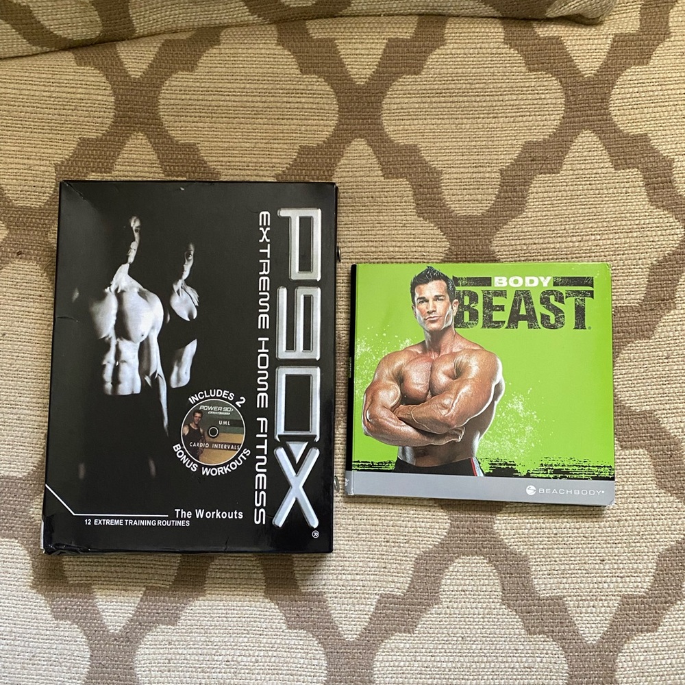 Two sets workout videos. P90X and Body Beast
